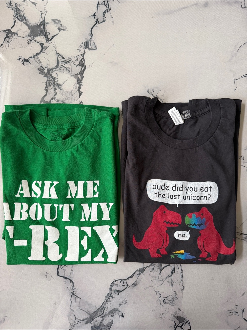 Bid kids Small .  2  dinosaur fun shirts.  T-Rex inside of the shirt . Unicorn .